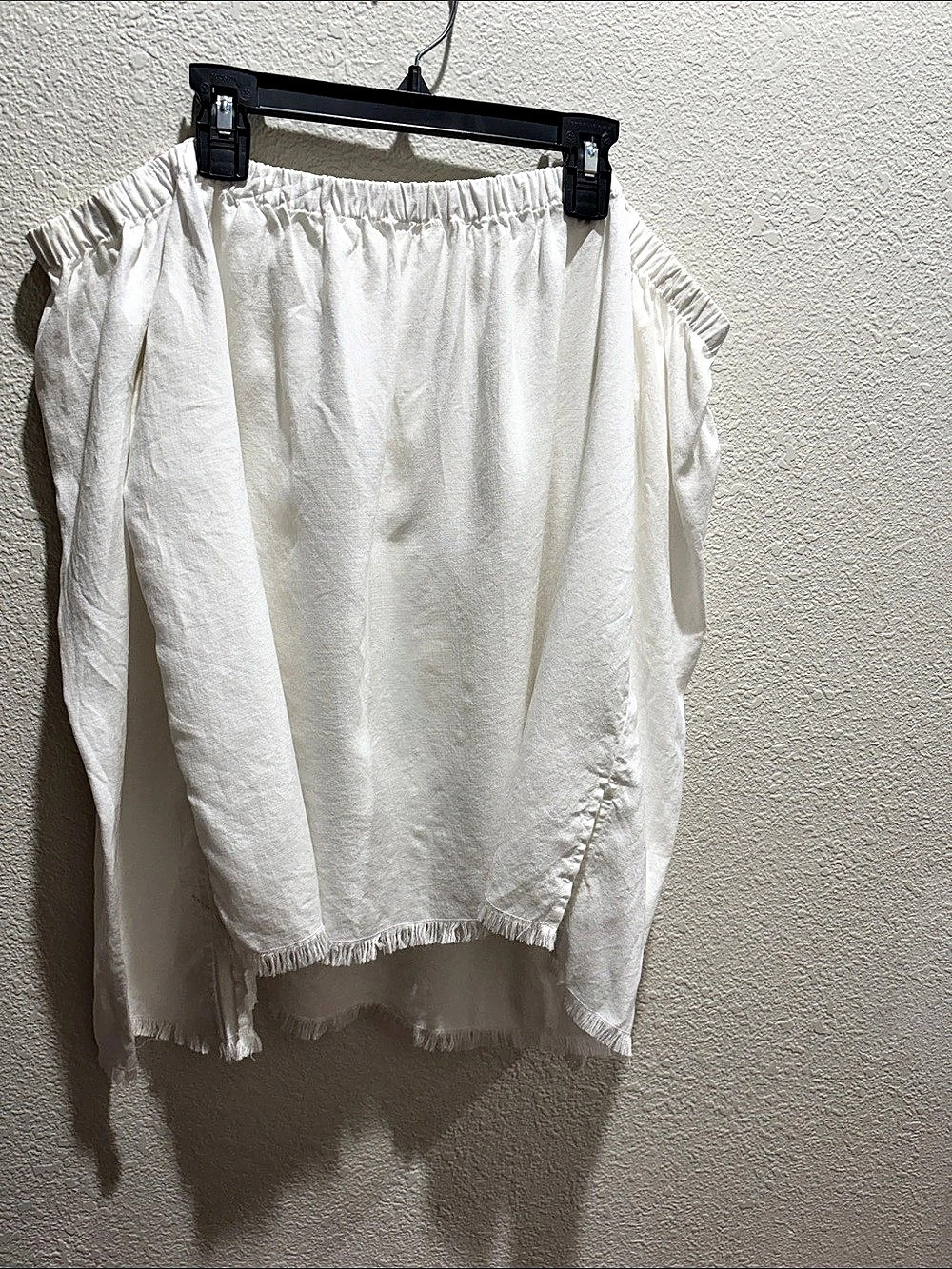 White Asymmetrical Frayed sleeves and hem top.